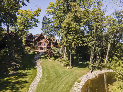 Log Cabin Mansion fronting Strawberry and Bass Lake with large oversized suites, photo 2