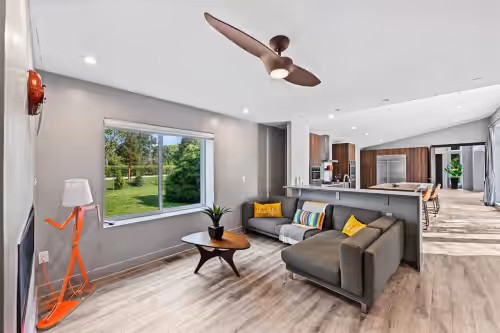 Fireplace room near kitchen at Contemporary Luxury Villa in Convenient Baltimore County