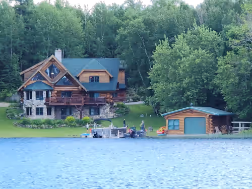 Beautiful handmade log home on private sand beach at the end of Big Bay, photo 2