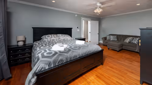 Primary bedroom #2 King size bed with full bathroom and a sitting area. 2nd FL at OPEN FLOOR PLAN-SPA LIKE MASTER BATH