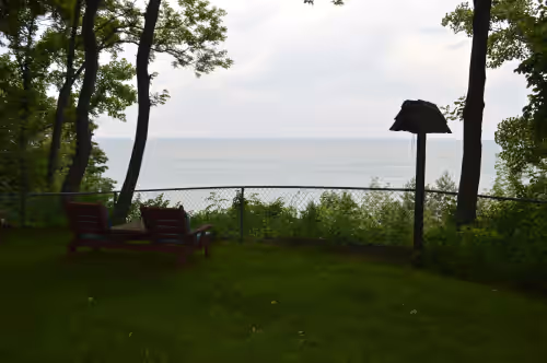 View of Lake Michigan from the bluff at *SPRING DISCOUNT!* Right on Lake Michigan! Large 2 acre yard and private beach