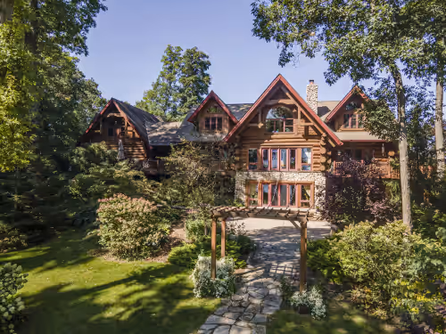 Log Cabin Mansion fronting Strawberry and Bass Lake with large oversized suites.
