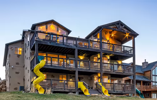 The "Big House" with.. Indoor Basketball, Trampoline and Play set, Theater Room