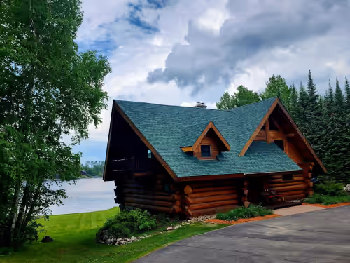 Beautiful handmade log home on private sand beach at the end of Big Bay, photo 3