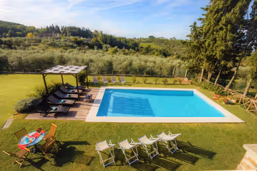 Relax around the pool at Charming Villa le Torri in Chianti, 8 ensuite bedrooms, A/C, Pool, Wi-Fi, Florence