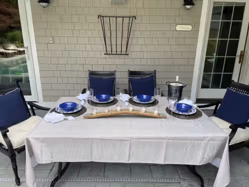 Outdoor dining at Beautiful Bristol Home across from Blithwolde Mansion