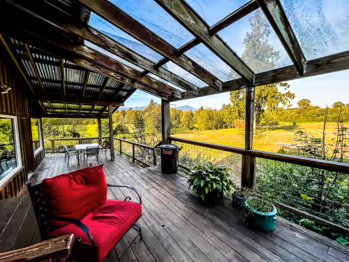 Outside Covered Deck- a beautiful place to entertain & and gather together at Cedar Springs Lodge & Retreat Center