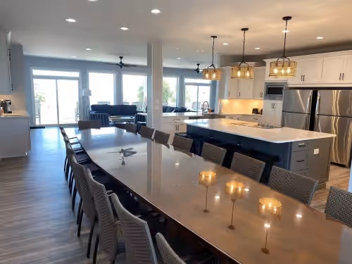 Enormous Banquet Table at FAMILY TIME SHINES HERE– Beachfront Home with Pool- 12 Bedrooms, 12 Baths