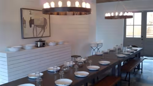 A large dining area for guests to congregate and enjoy a great meal together. at Beautiful Mountain Retreat Farm, Hot Tub,