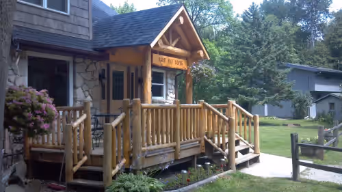 Roadside entry deck with patio-set. at Door County Waterfront Sleeps 23