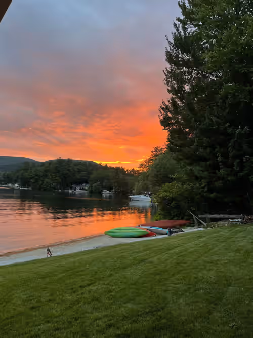 A quiet cove, the sunset and a sandy beach, on Lake Winnipesaukee