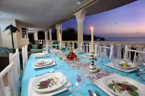 Outdoor dining with glorious sunsets at Private Beach Ocean Front Relaxed Luxury Life