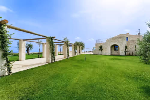 Property grounds at Panoramic villa for groups: garden, large infinity pool, large veranda