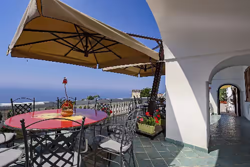 Outdoor dining at Villa Elena is a prestigious villa with a pool and suggestive sea view