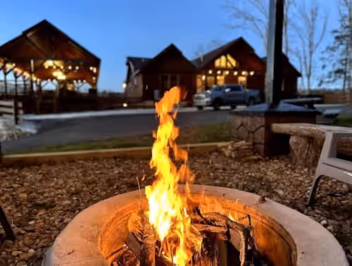 Outdoor Fire Pit private for only you and your guests at Luxurious Amazing 1 of a Kind Cabin InCabinHeated Pool Sauna Games