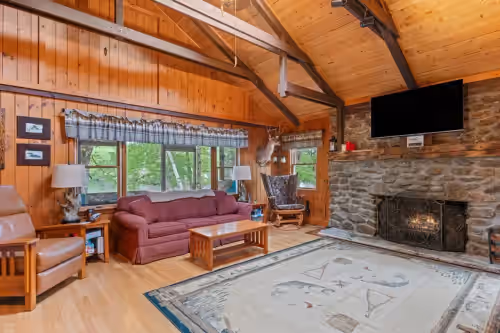 Living Room with Beautiful Vaulted ceilings and Exposed Beams at Lakefront Cabin/ 314` Shoreline