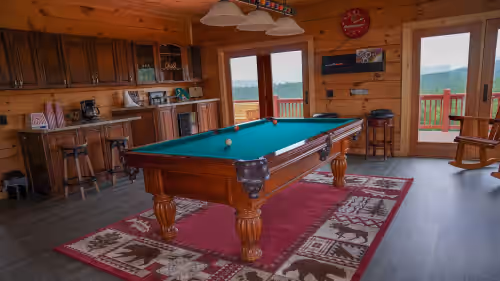 Game Room loaded with fun activities, large screen TV, Pool Table, Arcade, etc. at Prime Mountaintop Luxury Lodge, Spacious