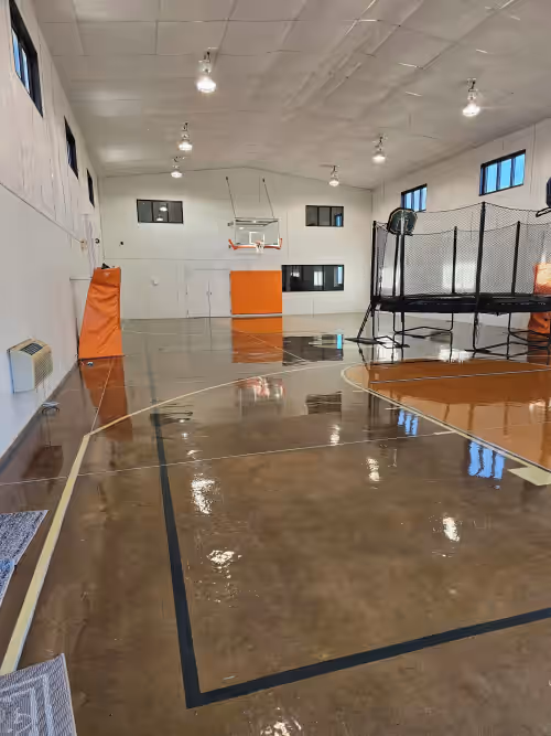 Sport court at Family-Friendly Nebraska Estate with Scenic Pool, Gym, Theater & Fire Pit Fun