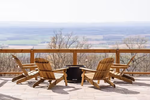 The fire pit and gorgeous background views overlooking the valley at Mountain Luxury