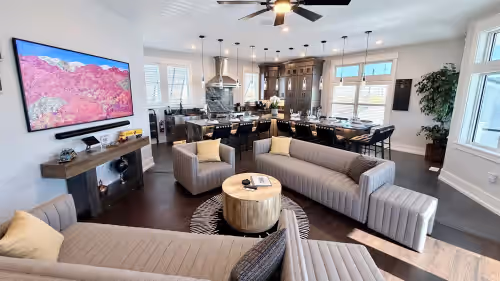 Open Plan living at its finest - Living Room & GE Cafe Chef’s Kitchen! at Still Waters