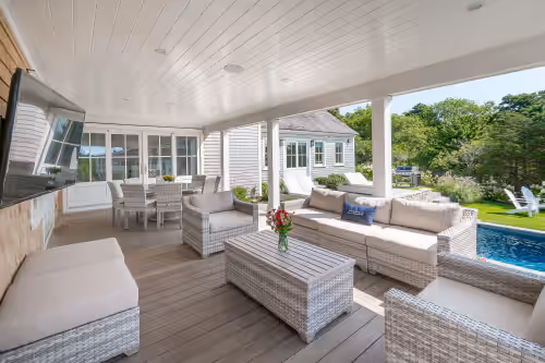 Terrace/patio at RARE-RENT 2 HOMES ON 1 PROPERTY WALK TO TOWN! 8 BR suites, pool, home theater