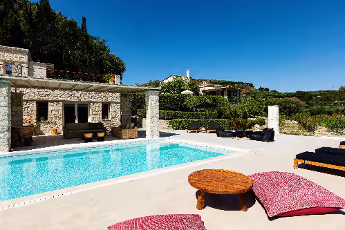 Sophisticated pool surroundings offering a sense of tranquility. at A Grand Estate, with 2 Pools, Gym & Tennis Court