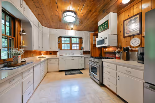 Updated appliances, with lots of counterspace for all your family meal prep. at Secluded Nostalgic Lodge, Room for All,