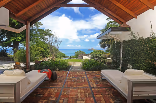 Enjoy views of Pigeon Island and Martinique from the North Lounge at Morne Trulah Estate