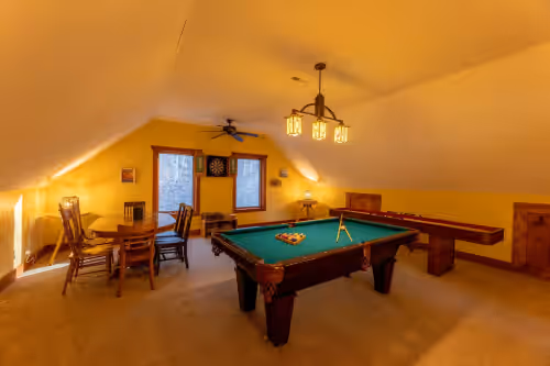 Pool table, shuffle board, and darts in the game room at 5BR Ski Chalet•Mins2slopes•3 Kings