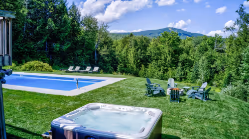 Hot tub and firepit are great after a day of fun. at Luxury 9BRs Stratton Estate. Total Privacy, Incredible Views! Swimming