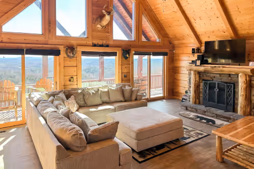 Comfy large sofa by fireplace at Huge 8BR Mountaintop Mansion, with Majestic Views,Oversized deck in Mt.Airy, NC