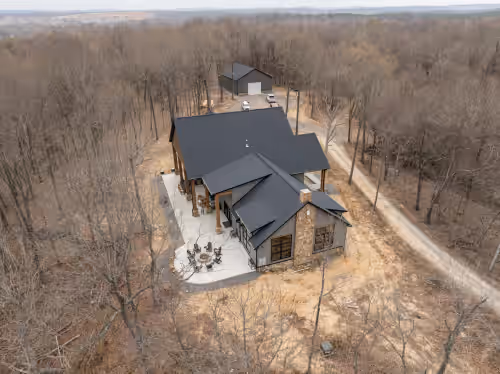 Exterior at Scenic River Front Lodge With A Fire Pit And Outdoor Kitchen