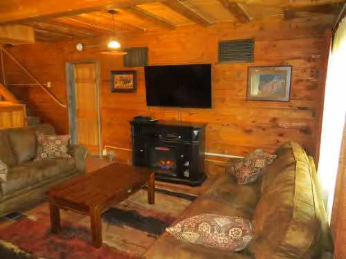 Great Room with Satellite TV and DVD player. at The Pine Valley Lodge