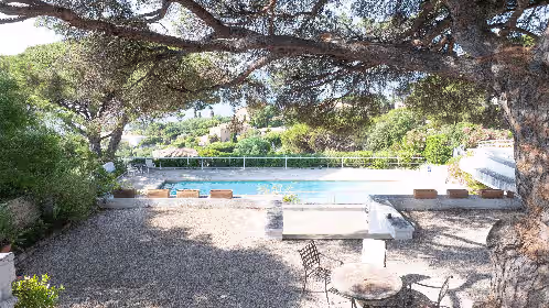 Outdoor dining at Superb vintage design luxury villa with pool and St Maxime sea view