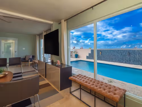 Living Room View at Large Ocean Front Home on Sandy Beach With Pool