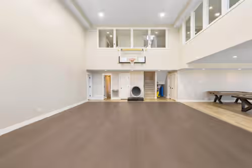 Indoor basketball lower level with slide exit from top floor at Private pool, hot tub, indoor basketball court, massive