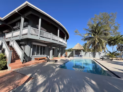 Large pool deck and patio at Villa Shore Belize