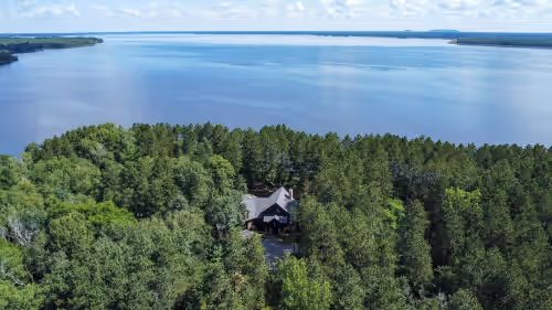 Aerial view at Experience luxurious lakeside living in our 5-bed, 5-bath retreat