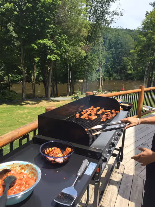 3 outdoor grills & extra propane tanks provided with beautiful river views! at Luxury Riverfront Lodge sleeps 25 w/ Heated