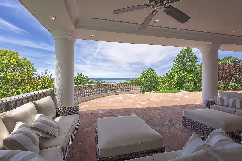The outdoor seating area overlooking the lake at 17500sqft Private Branson Estate