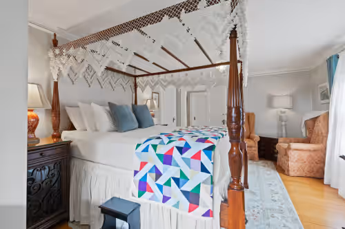 Queen bedroom with sitting area, water view at Waterfront Estate in Popham Beach