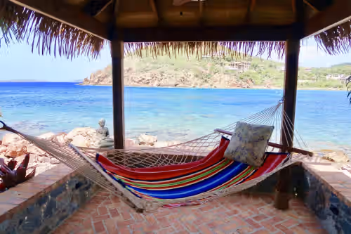Snuggle up to a good book & relax to this view! at LIME IN DE COCONUT VILLA