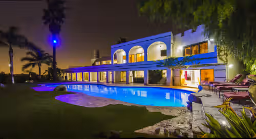 Evening photo pf the pool area. at Impressive Furnished 9 BR/10 BA Entertainment Dream Estate