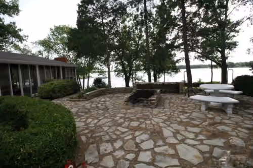 Fire pit. Additional outdoor seating can be moved from screened room. at Paradise On The Lake ~ Luxurious Peninsula Property
