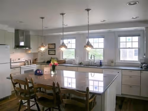 Kitchen with center island and quartz countertops at Ocean-View Oasis: Privacy