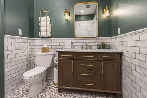 Delux Bathroom number 1 located nearest the king bedroom. Bedroom number 1. Hollyhock provides complimentary custom shampoo