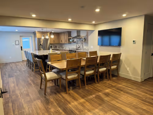 Dining at GRAND TRAVERSE GETAWAY Downtown luxury condo 3 blocks from the beach, sleeps 16