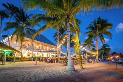Outdoor dining at Rum Reef, 6 bedroom house in North Side, pool, private beach, kayaks, bikes