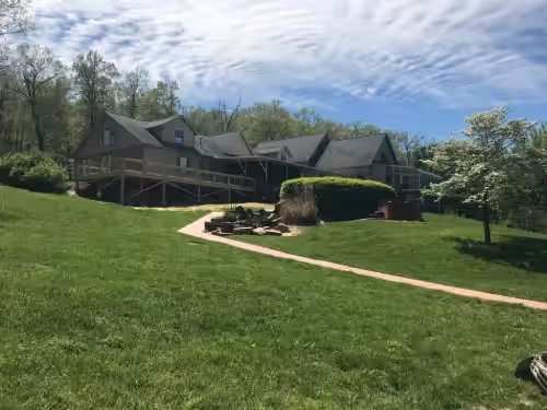 View of gorgeous lodge down near dock at Family-Friendly Lakeside Resort-like Home for Reunions, Retreats & Large Groups